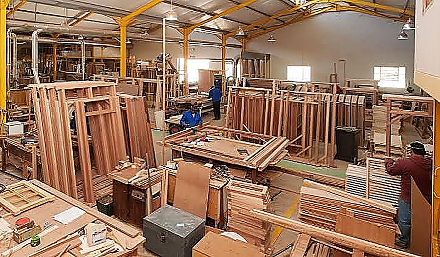 Carpentry workshop with timber door frames and joinery in production