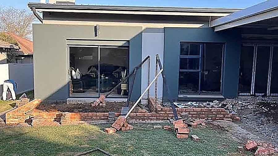 Home extension in progress with new brickwork against the existing house