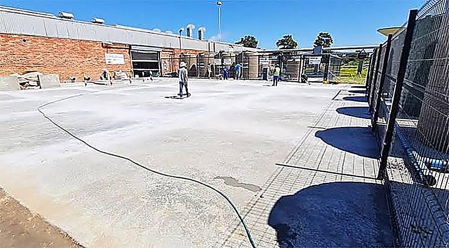 Large freshly finished concrete surface at a commercial site